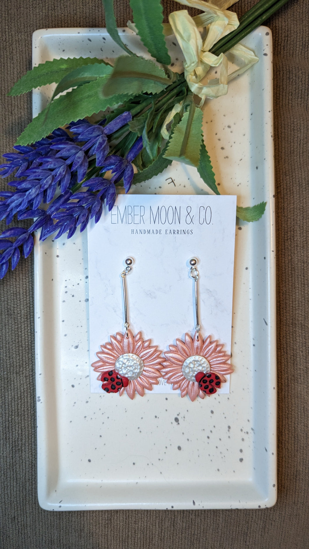 Pink sunflowers with ladybugs